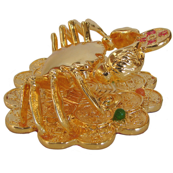 Golden Crab Sitting on Coins