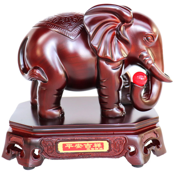 Feng Shui Elephant Holding a Red Jewel with Trunk Down